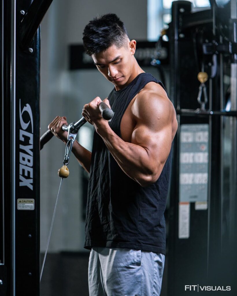 Person doing bicep curls in gym